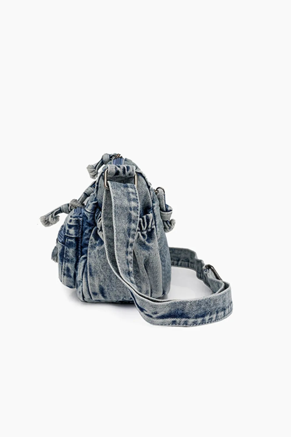 Medium-sized stylish denim crossbody bag with adjustable strap, perfect for everyday use and carrying essentials.
