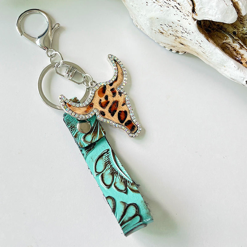 Rhinestone bull head keychain with leopard print and turquoise embossed genuine leather strap on silver alloy ring and clasp