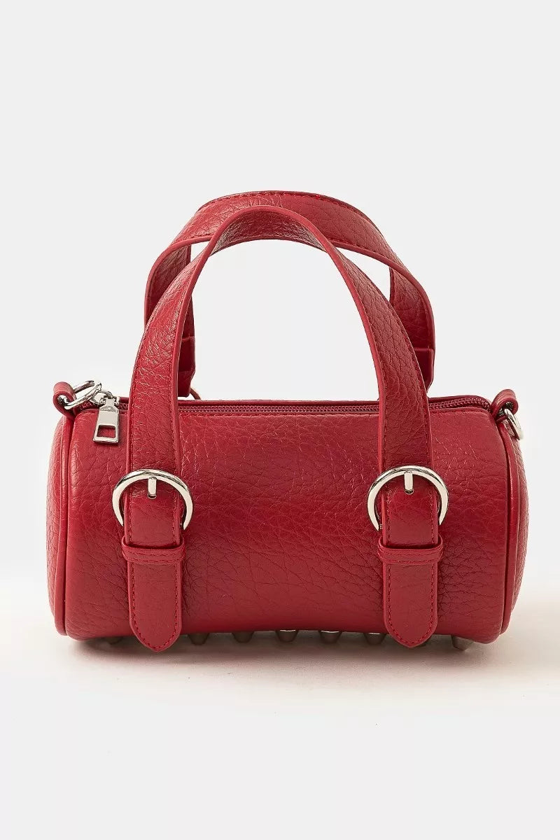 Red cherry leather mini handbag with silver buckle hardware, double handles, and zippered closure for secure carrying.