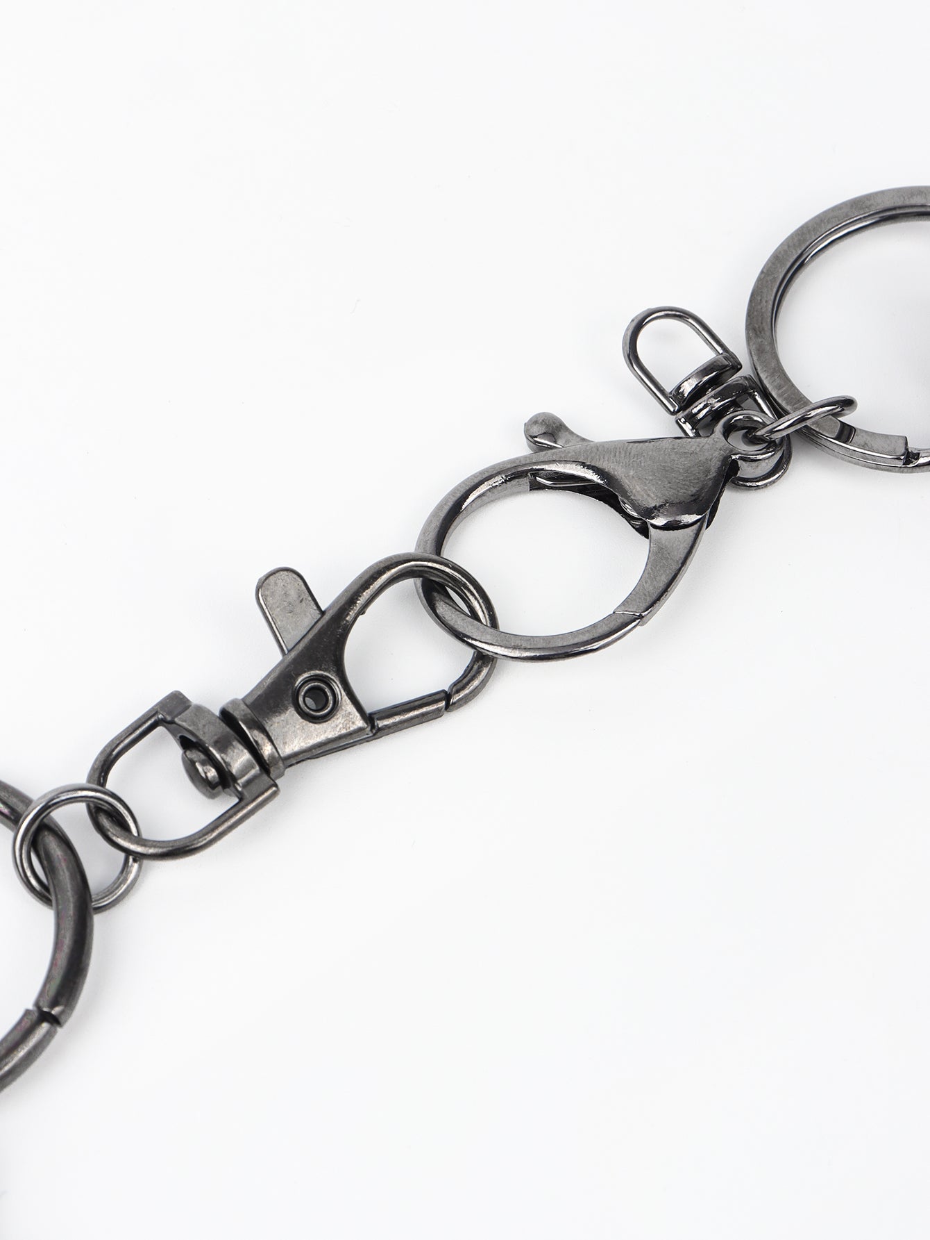 Close-up of a black aluminium double chain link wallet chain with clasp and keyring on white background