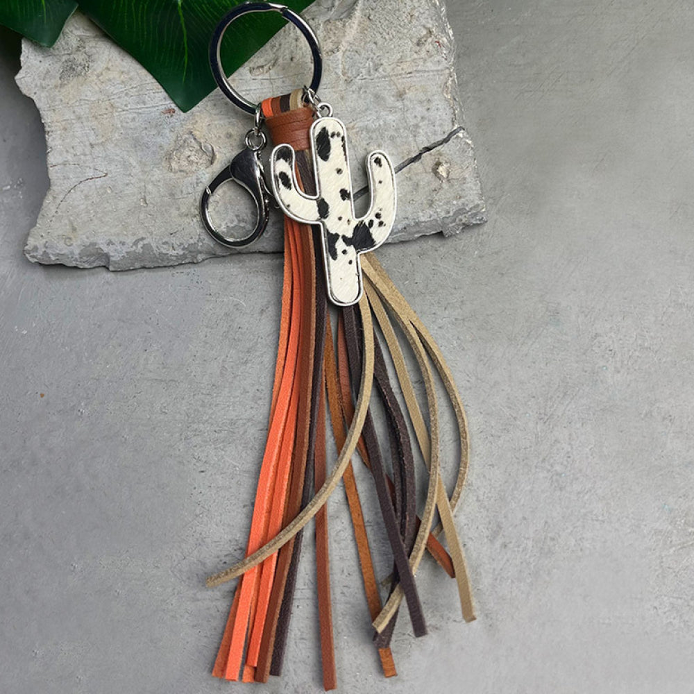 Cactus keychain with cowhide tassel in brown, orange, and beige tones attached to a silver alloy ring and clasp.