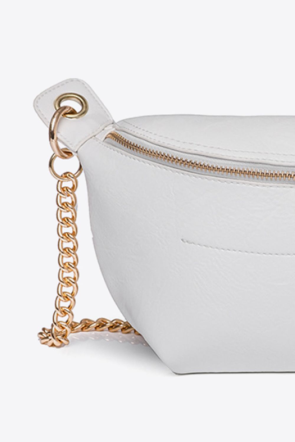 Close-up of a white PU leather bum bag with gold chain strap and gold zipper detail on a white background.