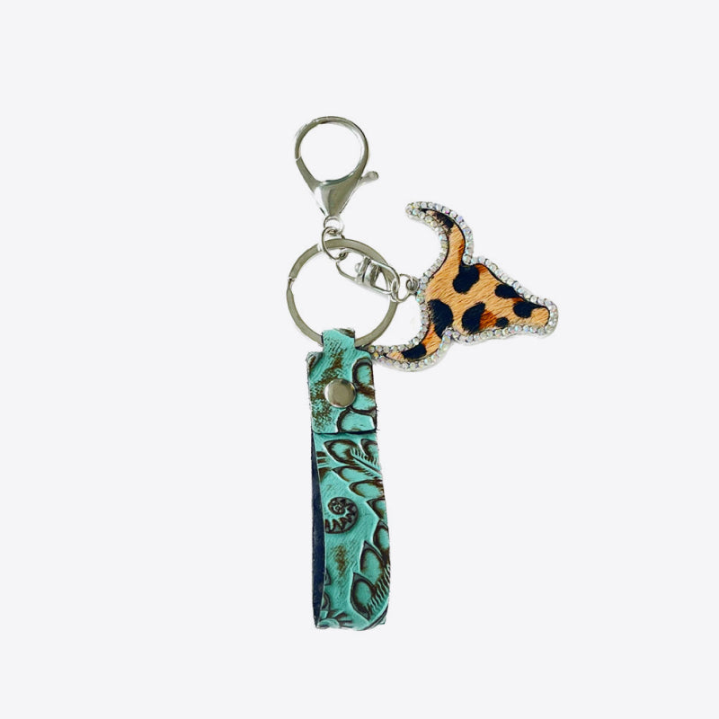 Rhinestone bull head keychain with leopard print and turquoise embossed genuine leather strap, 5.8 inches long.