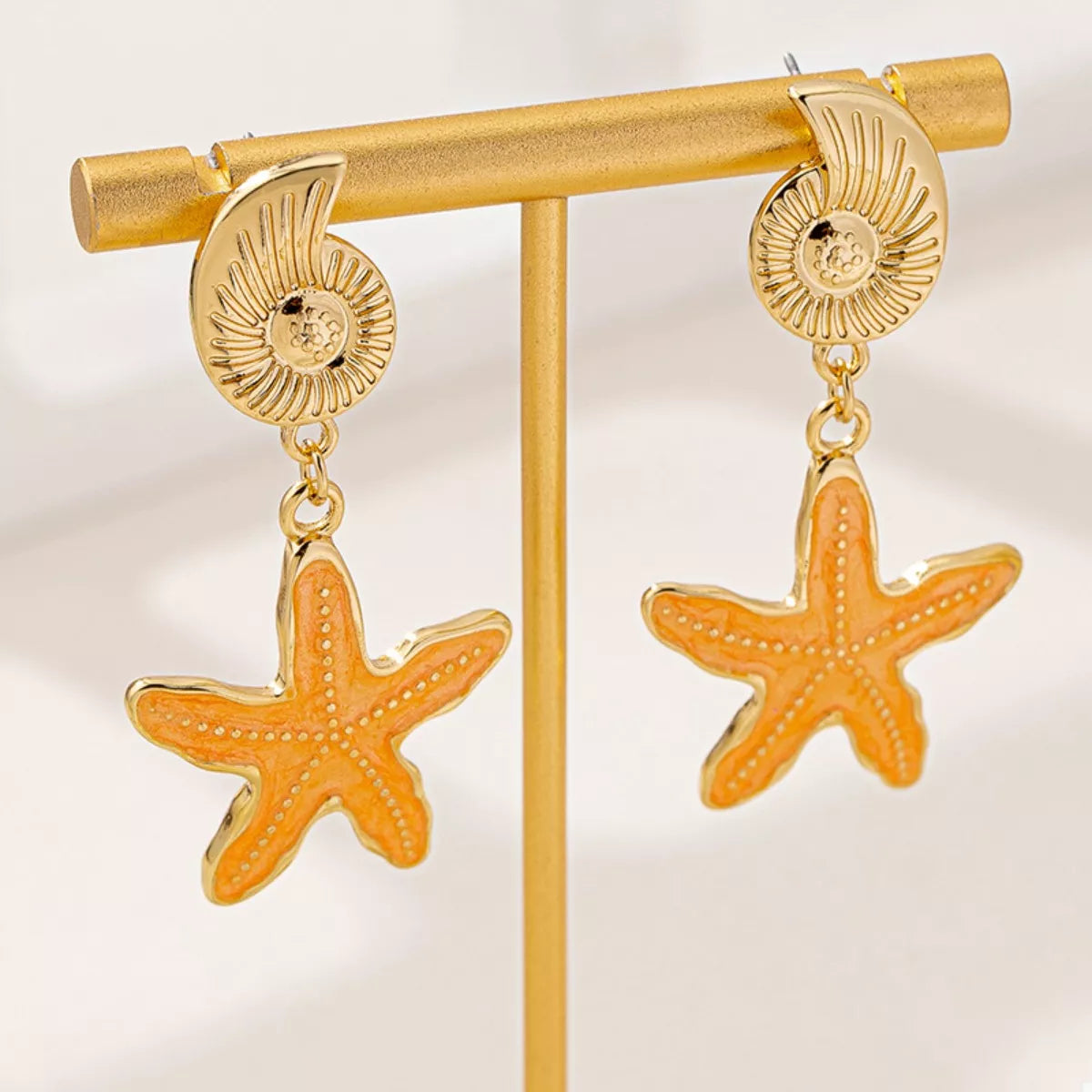 Gold starfish charm earrings – beach jewelry style