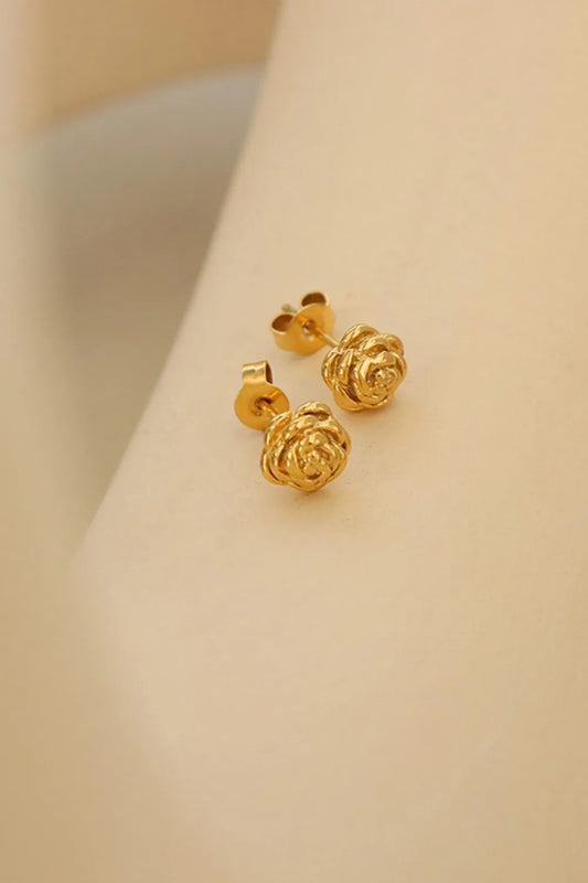 18K gold-plated flower stud earrings with titanium steel posts displayed on a beige surface.