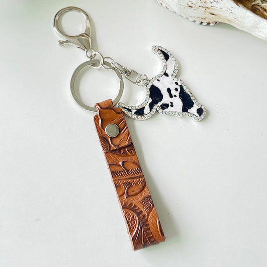 Rhinestone bull head keychain with genuine leather strap and alloy hardware measuring 5.8 inches long