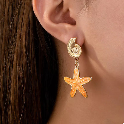 Gold seashell star charm earrings – beach jewelry style
