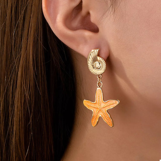 Gold seashell star charm earrings – beach jewelry style