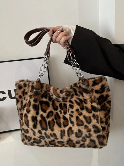 Large leopard print shoulder bag made of soft faux fur with chain and leather handles for stylish everyday use