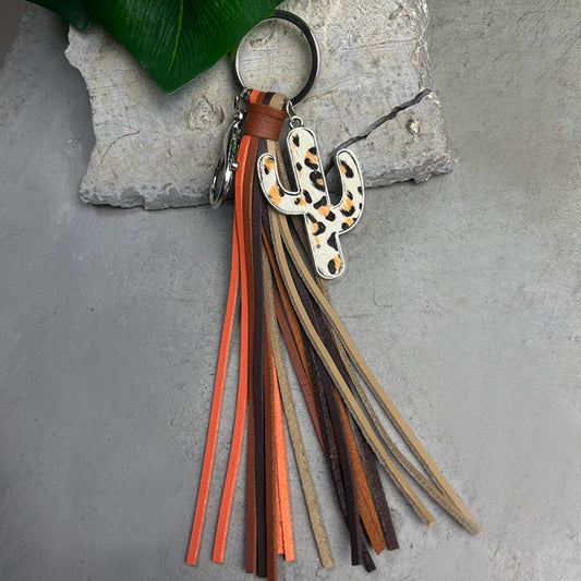 Cactus keychain with cowhide tassels in brown and orange tones, featuring an alloy leopard print cactus charm.
