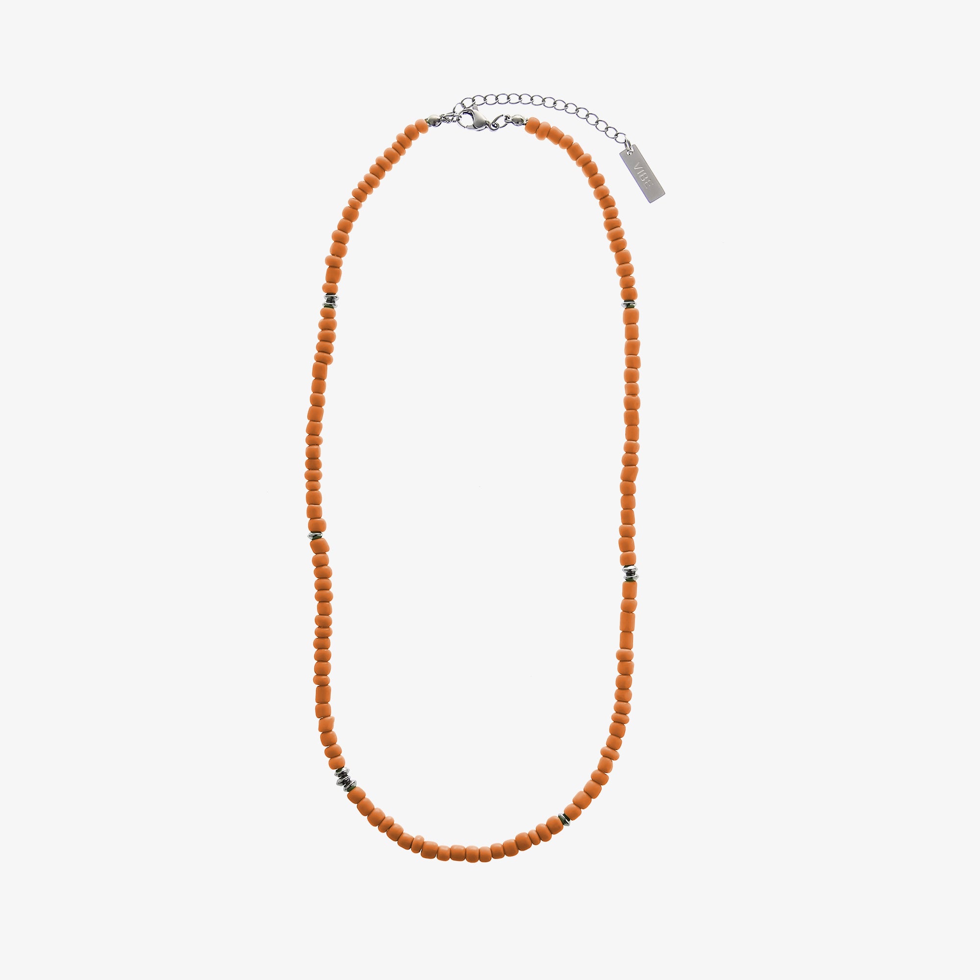 Orange beaded necklace on a white background