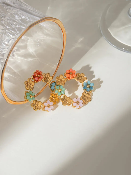 Gold-plated stainless steel flower earrings with multicolored synthetic crystals arranged in a circular pattern