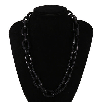 Chunky acrylic link chain necklace in black, stylish punk design for women, showcasing modern resin style.
