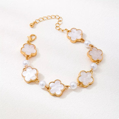 Lucky flower bracelet with gold trim and pearls 